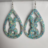 Translucent resin teardrop rabbit dangle earrings with colorful glitter on stainless steel hooks.