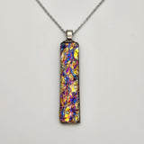 Pink titanium burl dichroic pendant with iridescent Dichrolam resin on stainless steel chain