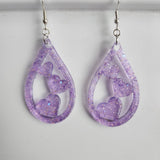Teardrop resin earrings with heart accents in multiple colors by Blue Bourbon Designs
