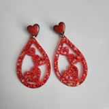 Teardrop resin earrings with heart accents in multiple colors by Blue Bourbon Designs