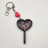 Heart wand shaker keychain filled with oil and floating charms