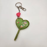 Heart wand shaker keychain filled with oil and floating charms