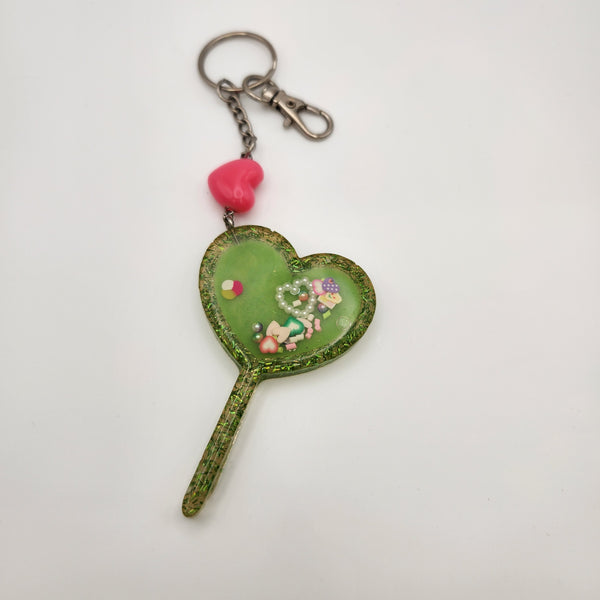 Heart wand shaker keychain filled with oil and floating charms