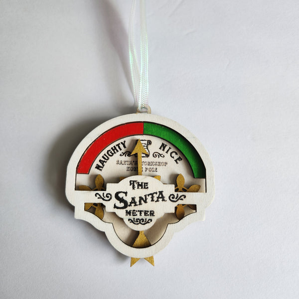 Wooden Christmas ornament showing naughty or nice meter