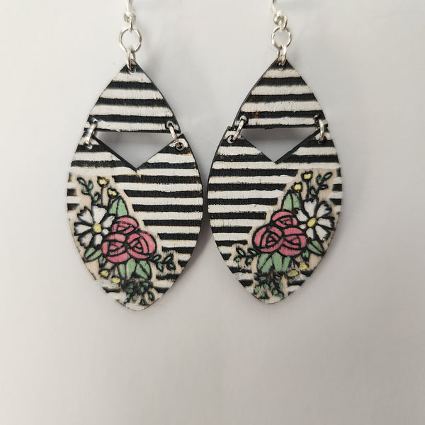 A pair of striped floral earrings with black and white stripes and 925 silver hooks.