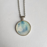 1-inch round resin necklace on silver stainless steel chain