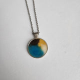1-inch round resin necklace on silver stainless steel chain