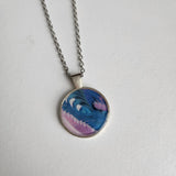 1-inch round resin necklace on silver stainless steel chain