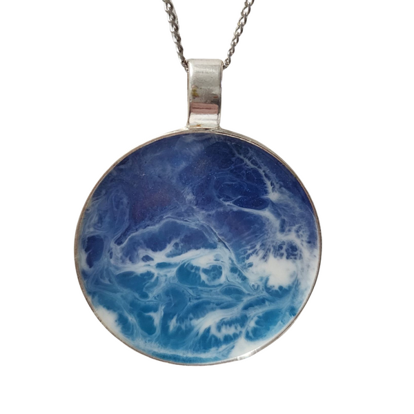 2-inch round ocean resin necklace with waves on a stainless steel chain