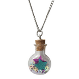 Round glass bottle necklace filled with magical items on stainless steel chain