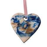 Handmade blue, gold and whte resin heart ornament with layered colors and iridescent hanger by Blue Bourbon Designs.