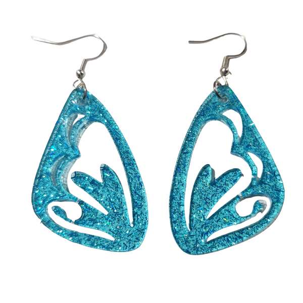 A pair of blue butterfly wing earrings with a glittery finish on stainless steel hooks.