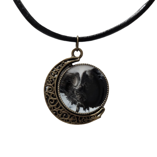 Reversible crescent moon pendant with two unique resin sides