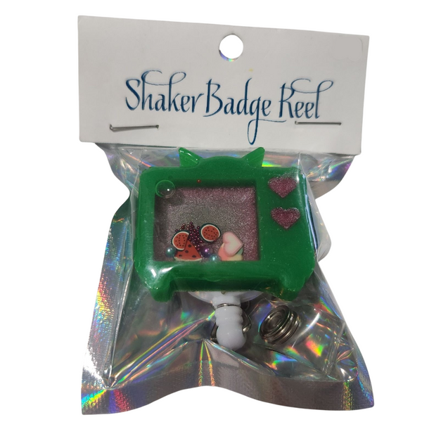 Retro-style TV shaker badge reel with floating charms