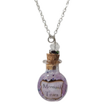 Round glass bottle necklace filled with magical items on stainless steel chain
