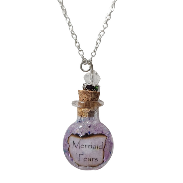 Round glass bottle necklace filled with magical items on stainless steel chain