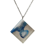 Multi-depth resin island pendant with layered land and water design