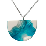 Multi-depth resin island pendant with layered land and water design