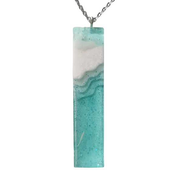 Multi-depth resin island pendant with layered land and water design