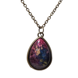 Teardrop alcohol ink resin pendant with domed finish on stainless steel chain.
