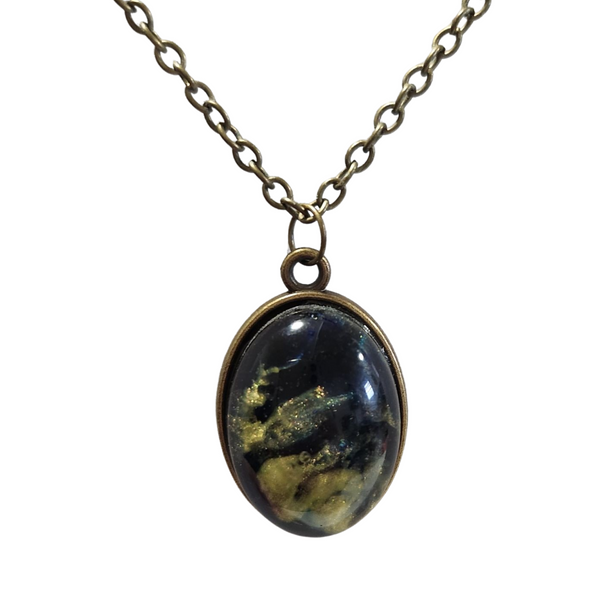 Oval alcohol ink resin necklace with domed resin finish on brass colored chain