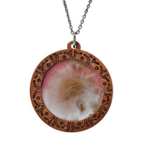 1.5 inch round wood pendant with resin-filled center on a stainless steel chain.