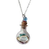 Round glass bottle necklace filled with magical items on stainless steel chain