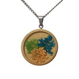 1-inch wood pendant with real dried flowers sealed in resin on stainless steel chain.