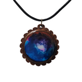 1.5 inch round wood pendant with resin-filled center on leather cord