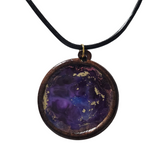 1.5 inch round wood pendant with resin-filled center on leather cord